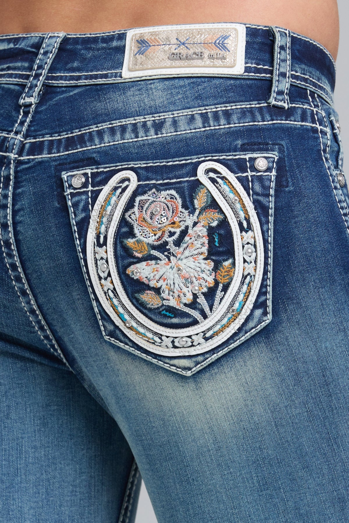 Product view 2 of blue bootcut jeans with horse shoe florals