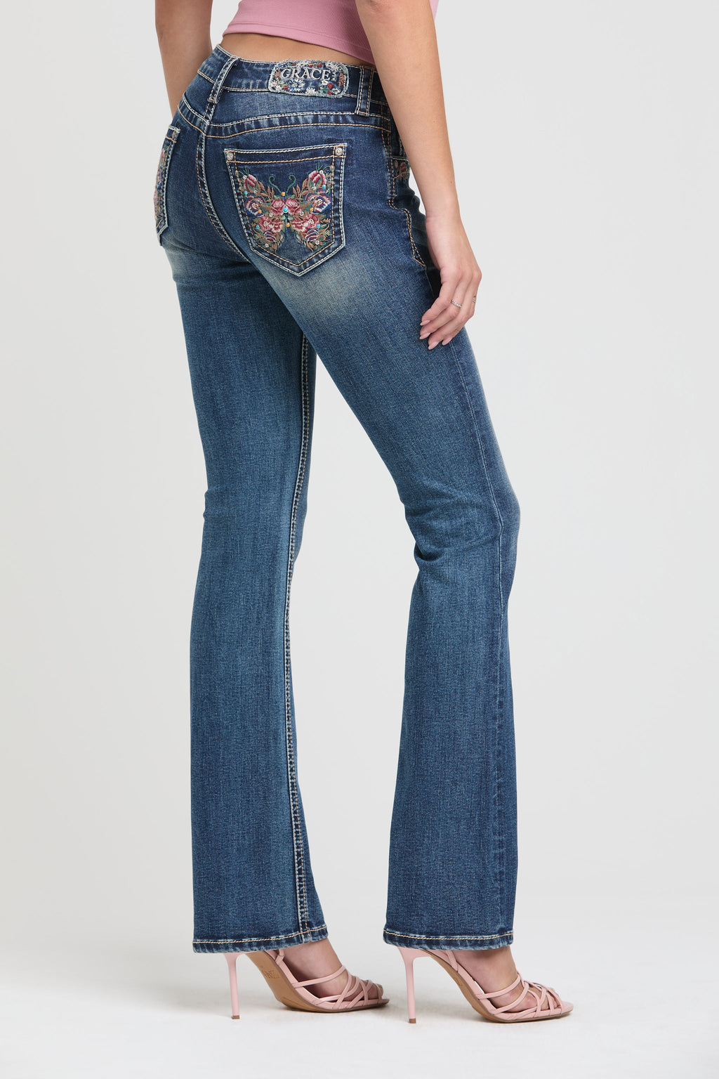 Product view 1 of blue bootcut jeans with butterfly florals
