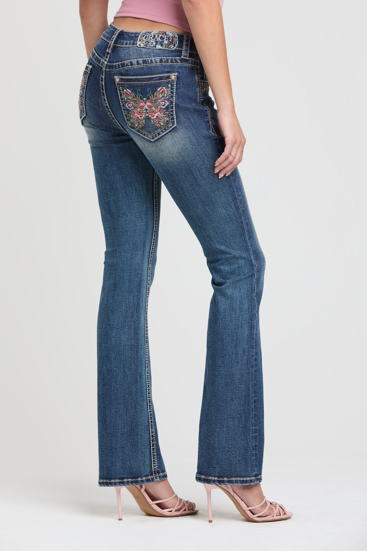 Product view 1 of blue bootcut jeans with butterfly florals