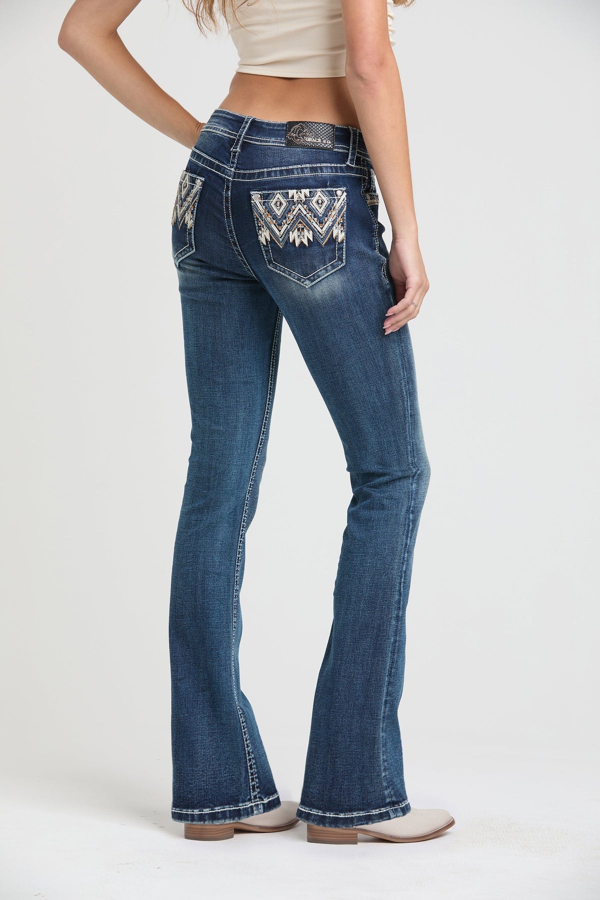 Product view 1 of blue bootcut jeans with aztec embroidery