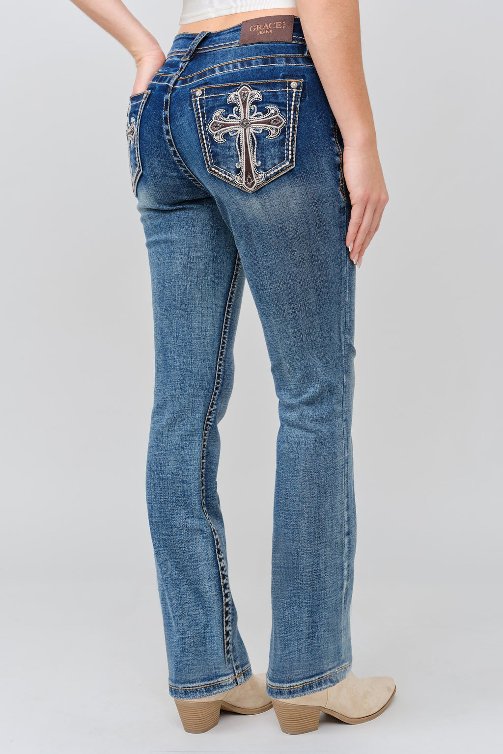 Product view 1 of brown bootcut jeans with brown cross detail