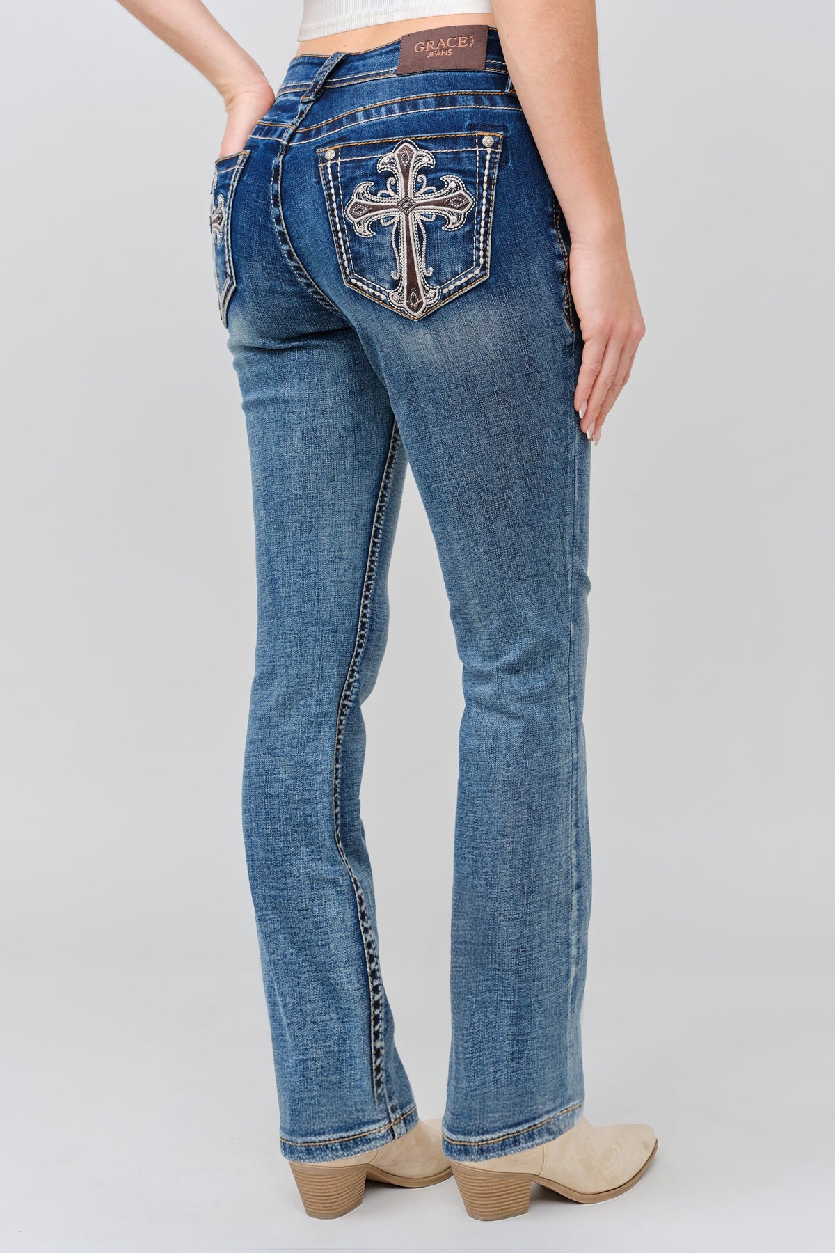 Product view 1 of brown bootcut jeans with brown cross detail