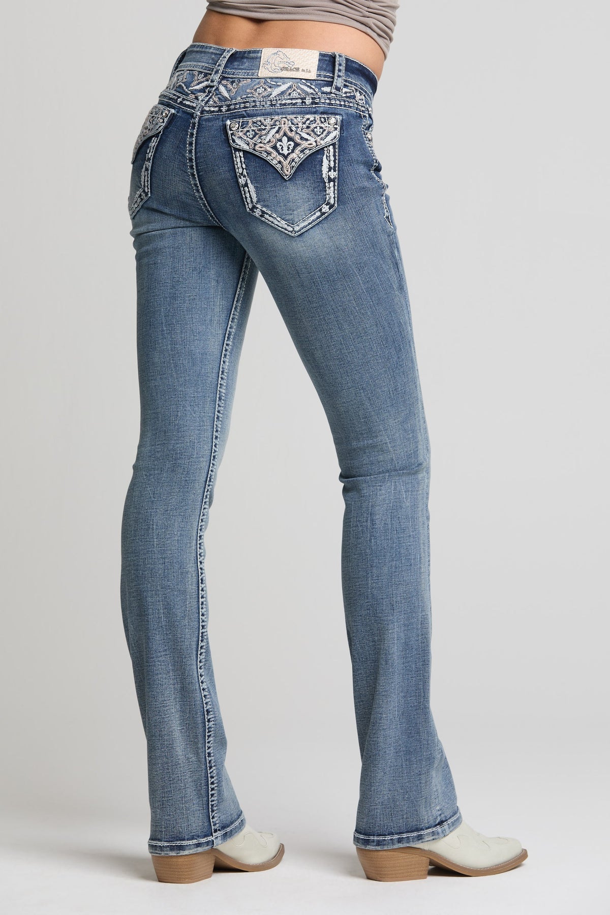 Product view 1 of blue bootcut jeans with aztec yoke detail