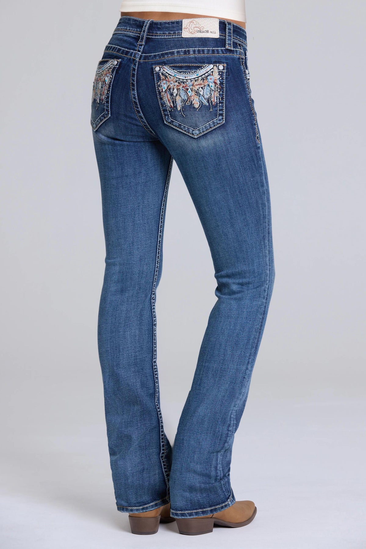Product view 1 of blue bootcut jeans with feather detail