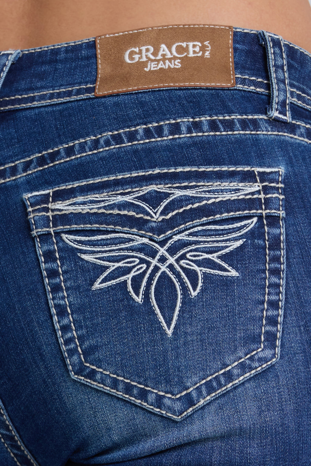Product view 2 of blue bootcut jeans with toe bug detail