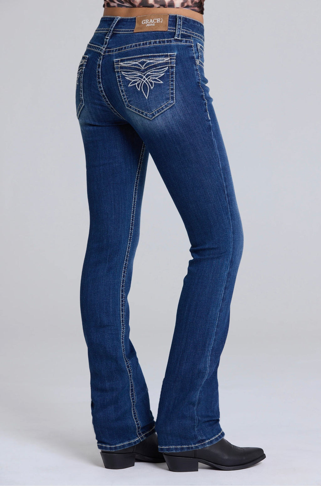 Product view 1 of blue bootcut jeans with toe bug detail