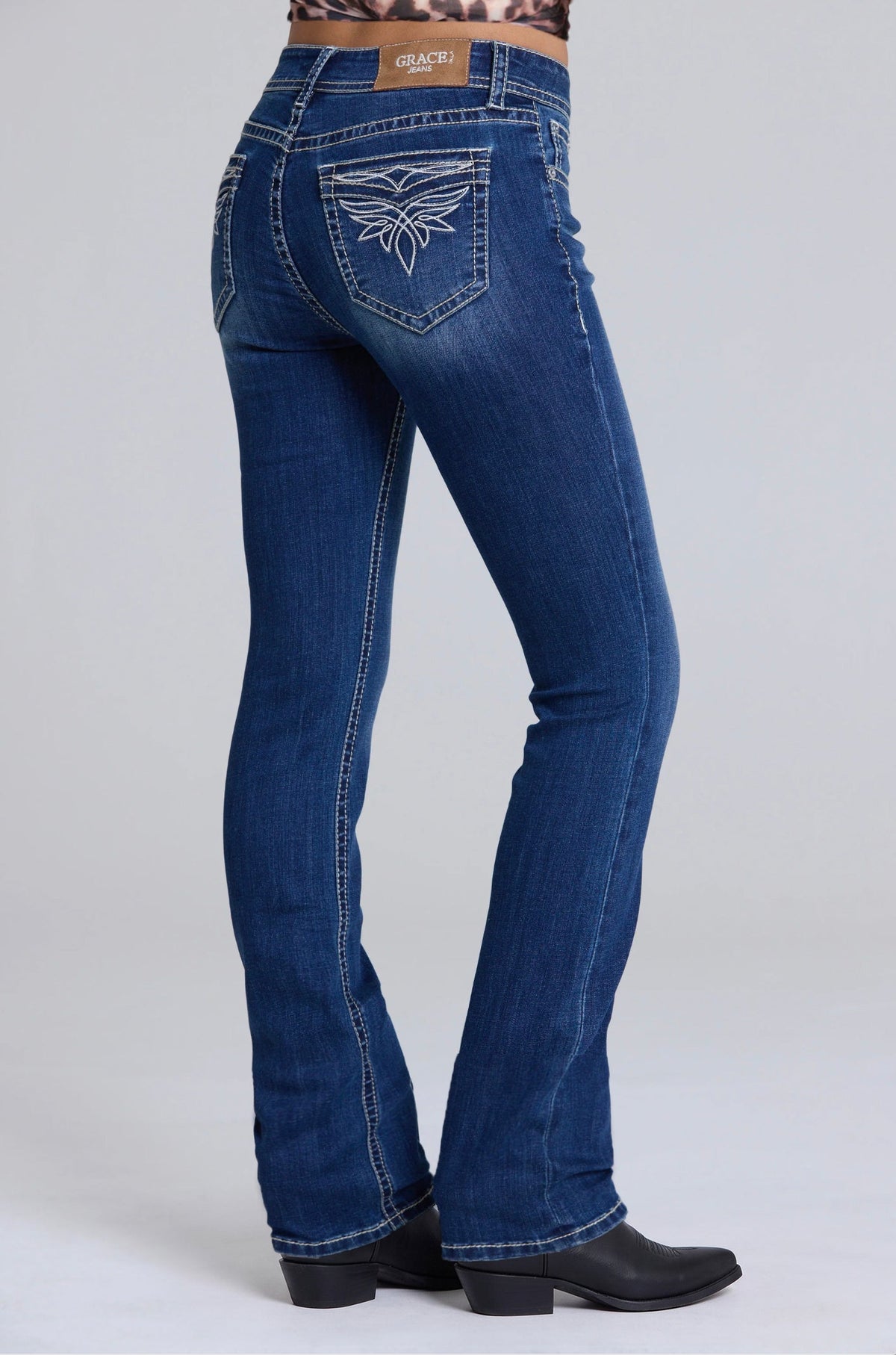 Product view 1 of blue bootcut jeans with toe bug detail