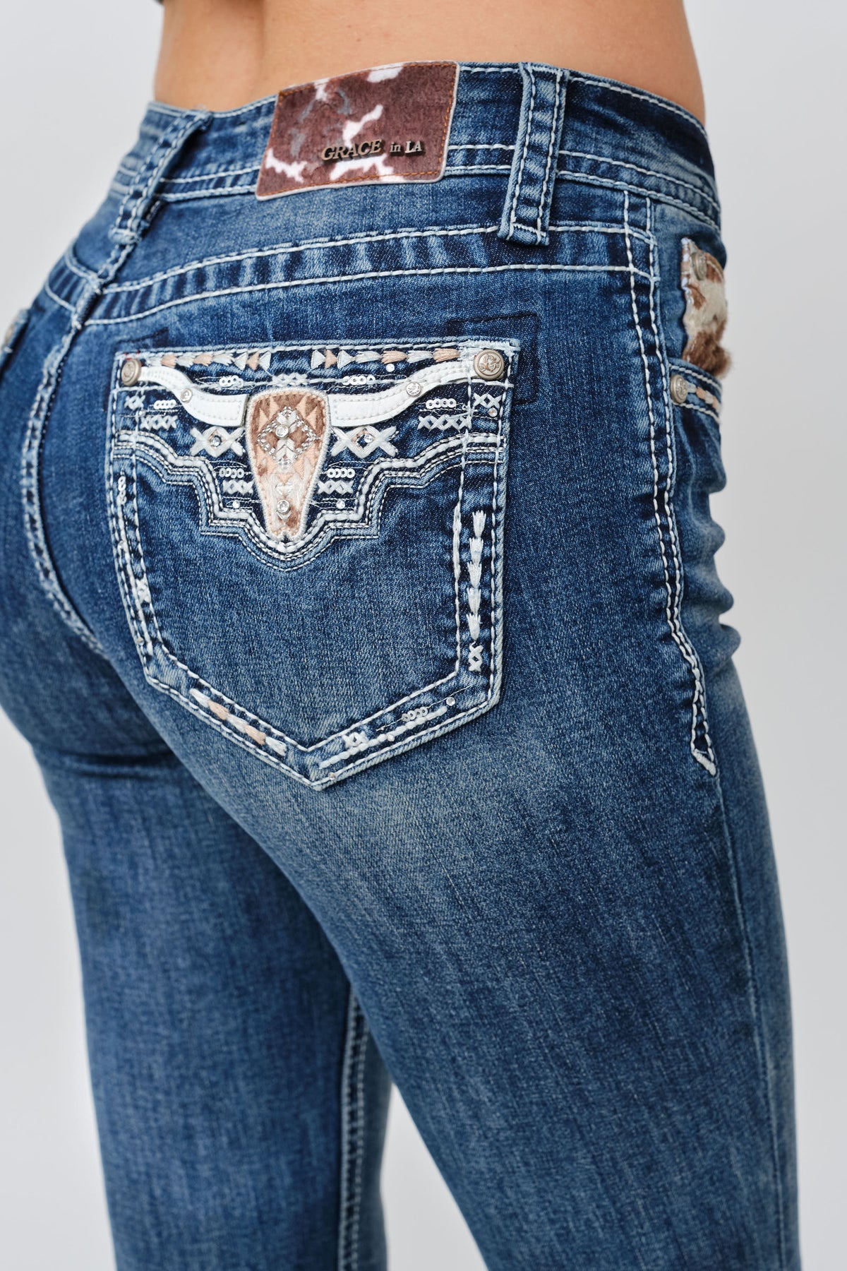 Product view 2 of blue bootcut jeans with steer detail